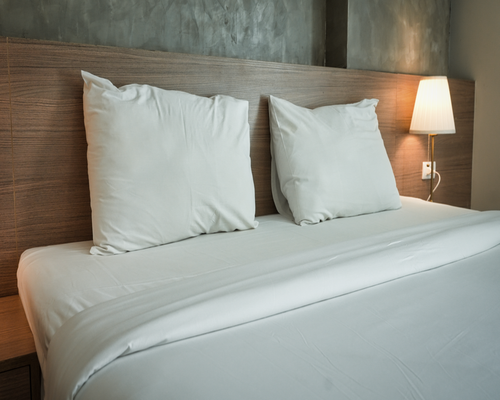 A neat and cozy bedroom set up for a good night's sleep